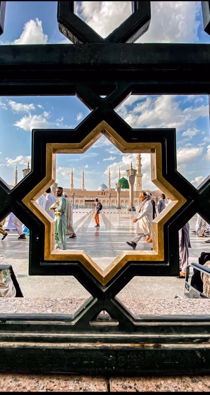 View of the Prophet's Mosque through ornate Islamic window